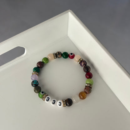 Multicolored beaded bracelet on a white surface