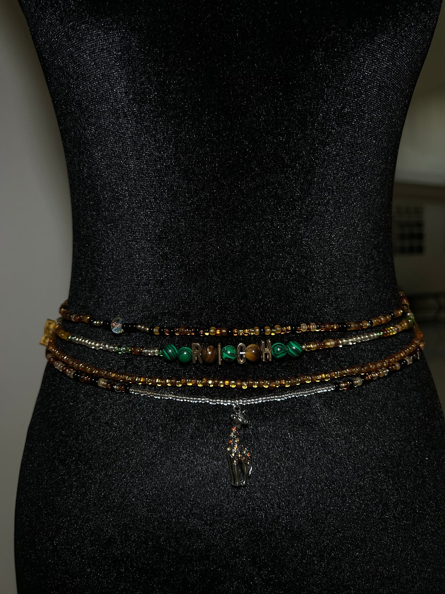 Giraffe charm on brown and gold waist beads