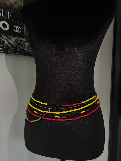 Black bow tie with colorful trim on a mannequin head, with a visible brand logo in the background.