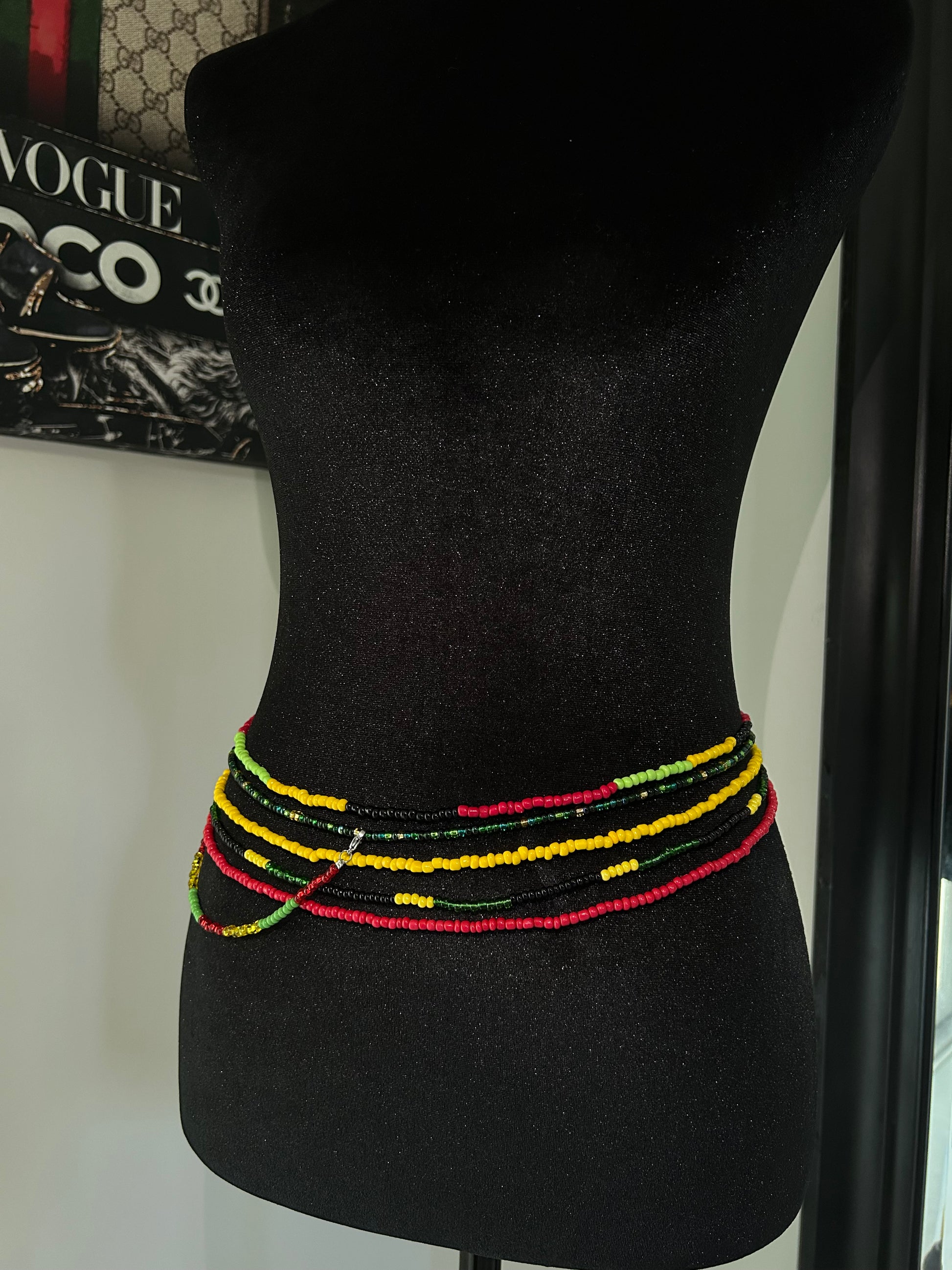 Black car headrest cover with colorful trim on a car seat.