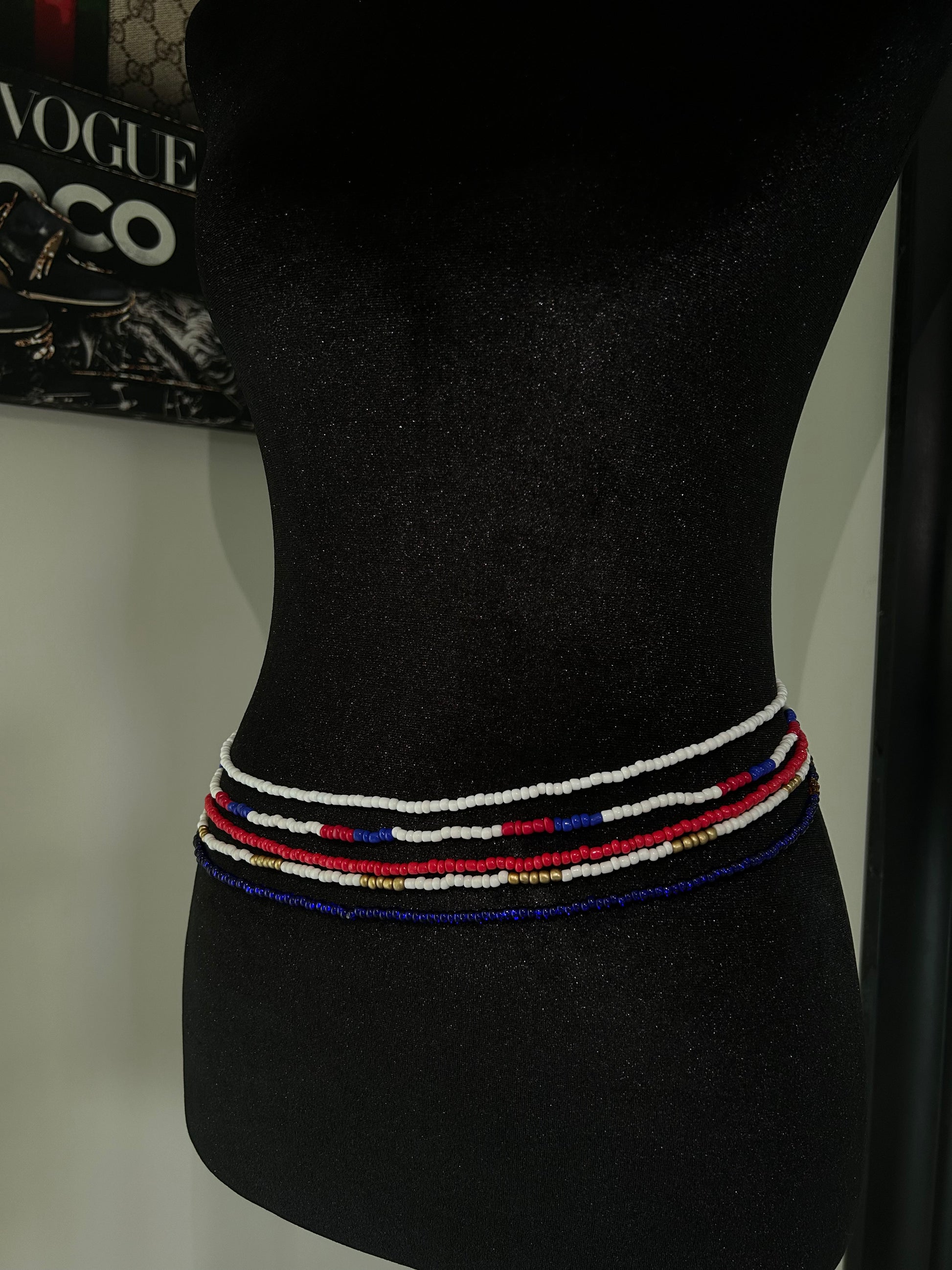Colorful waist beads, red white blue on mannequin