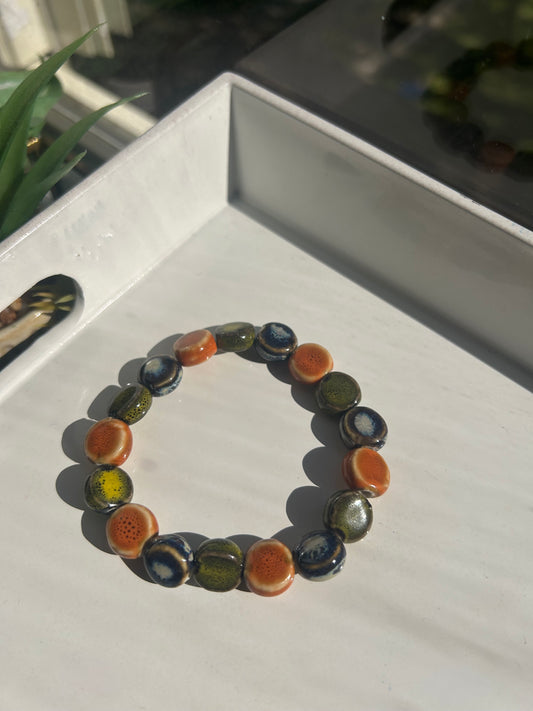 Multicolored beaded bracelet on a white surface