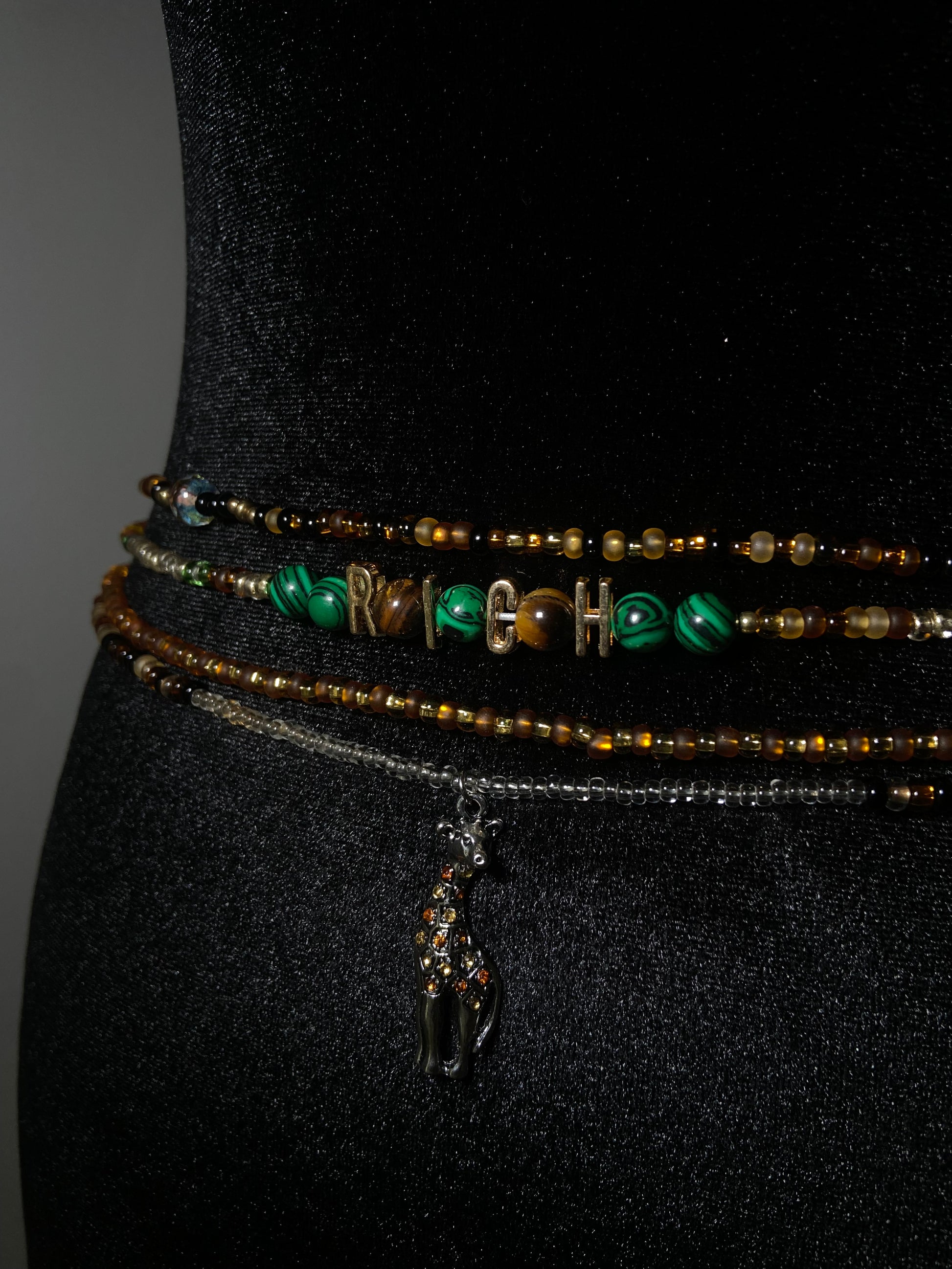 Set of beaded waistbeads on a dark background