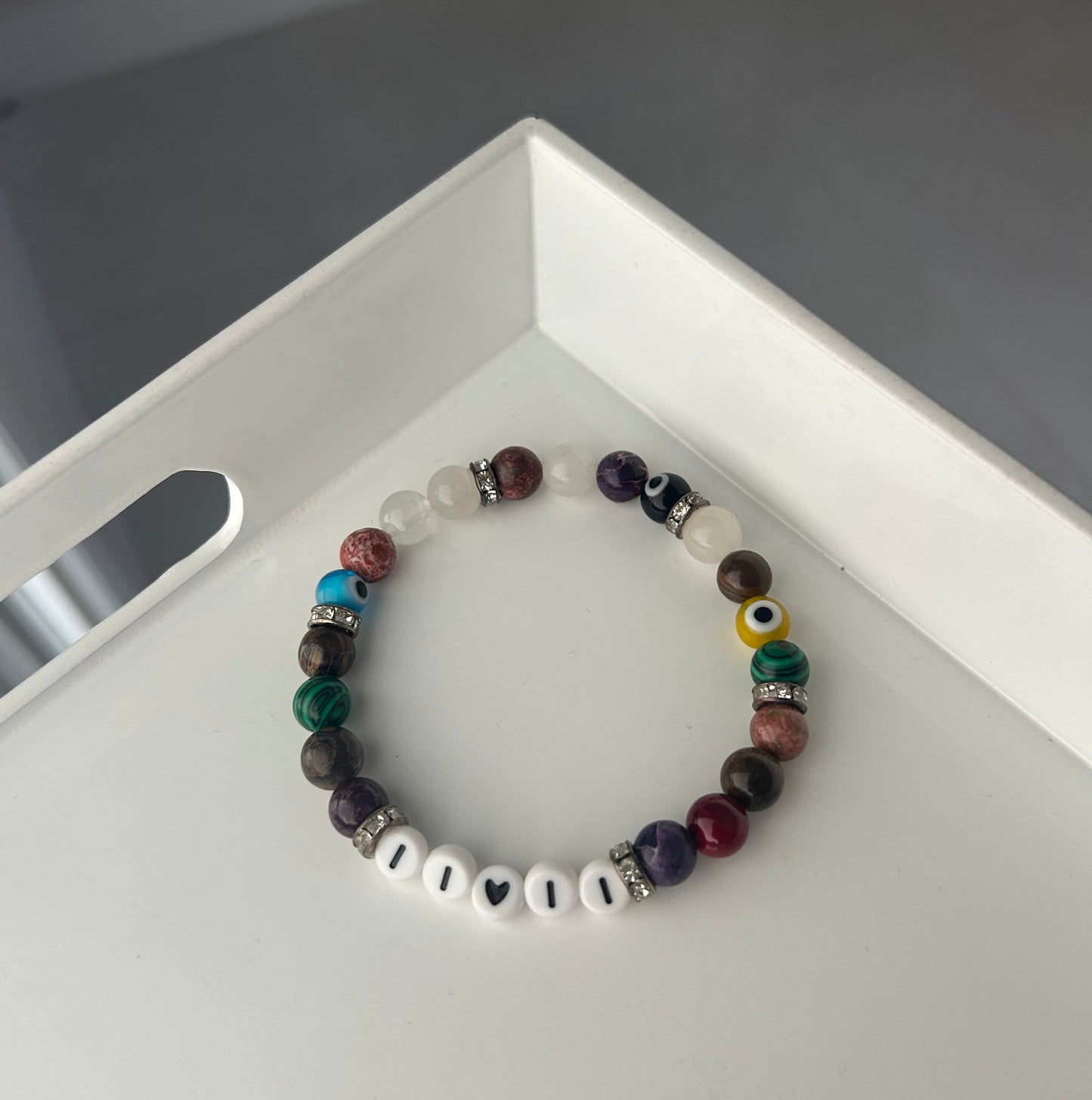 Multicolored beaded bracelet on a white surface