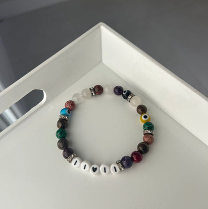 Multicolored beaded bracelet on a white surface