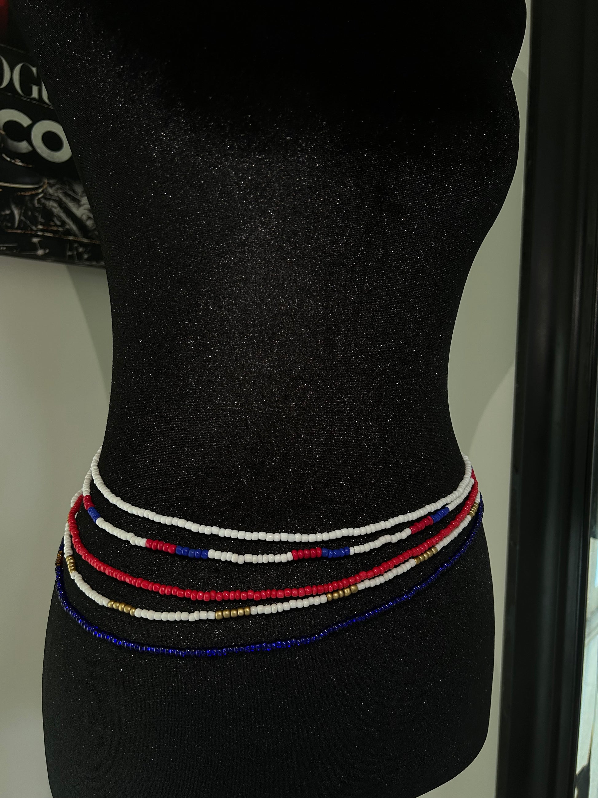 Dominican colored waist beads, red white blue on mannequin