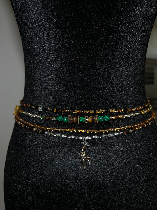 Set of beaded bracelets on a black mannequin waist 