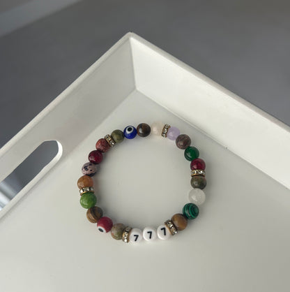 Multicolored beaded bracelet on a white surface