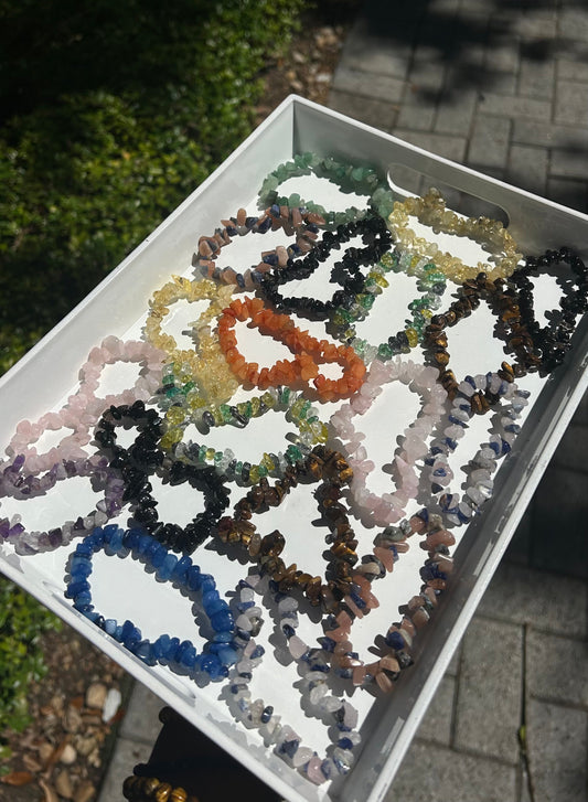 Colorful beads on a white tray outdoors
