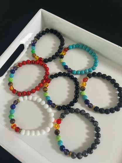 Set of colorful beaded bracelets on a white surface