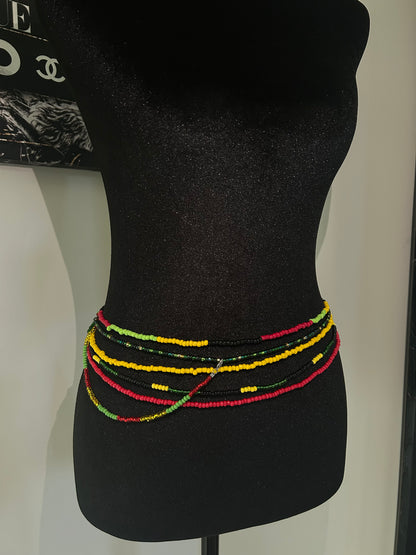 Caribbean color inspired waistbeads. Orange, yellow red green waist beads on mannequin