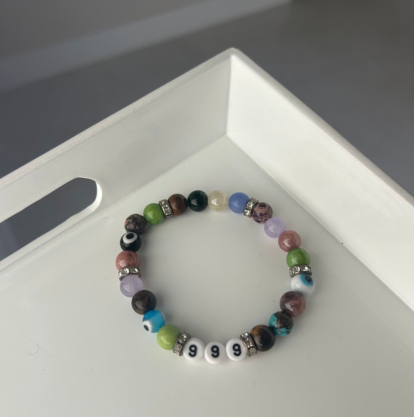 Multicolored beaded bracelet on a white surface