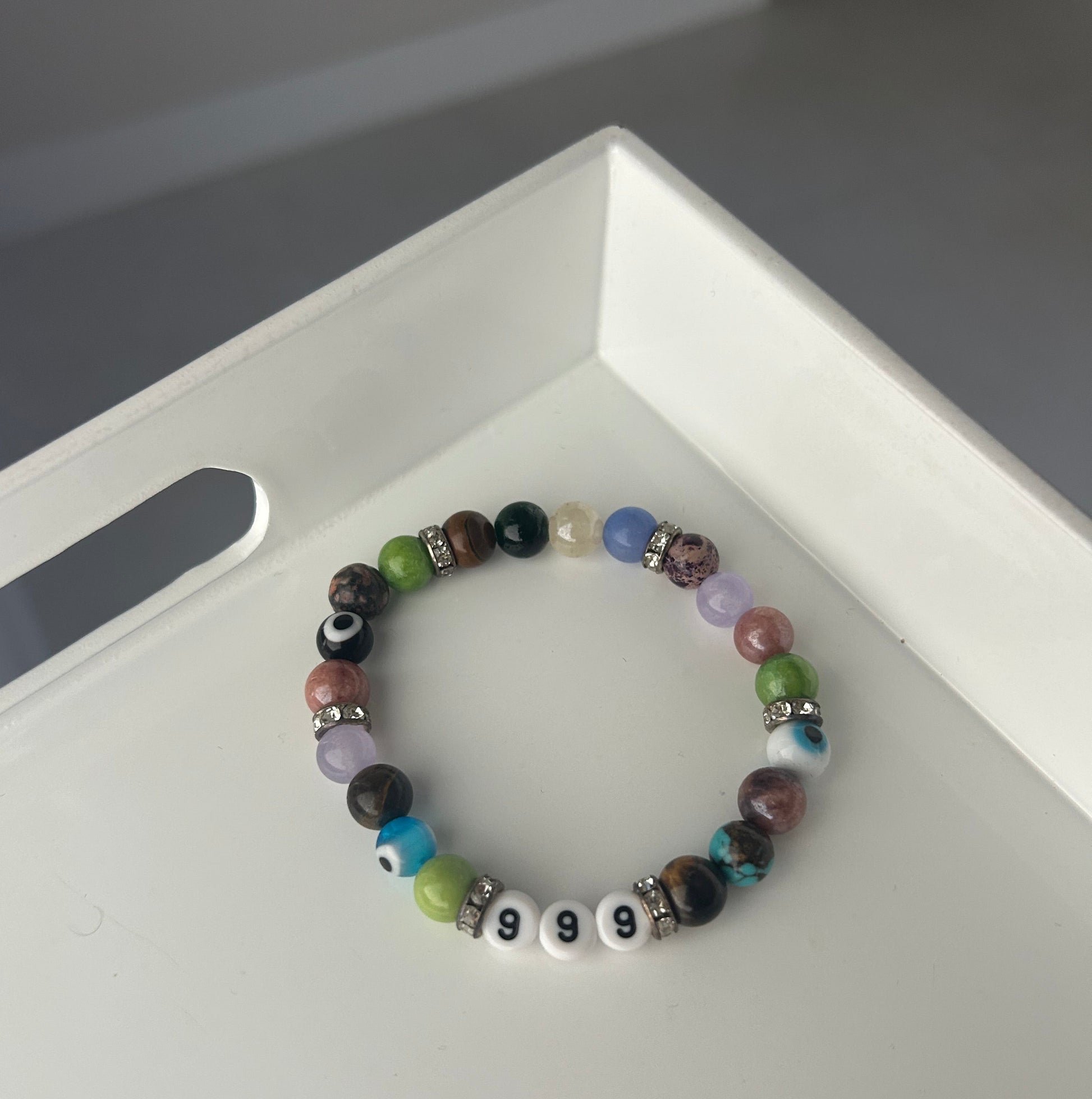 Multicolored beaded bracelet on a white surface