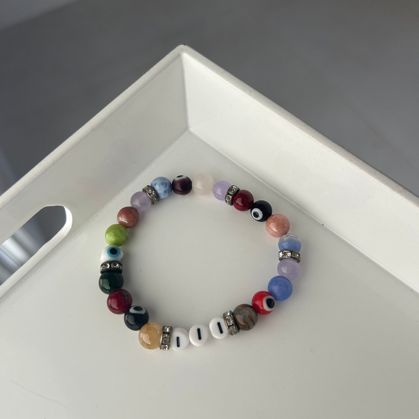 Multicolored beaded bracelet on a white surface