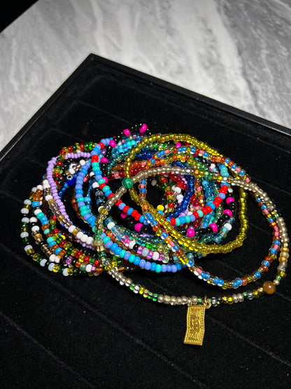 Multicolored beaded necklace on a black surface
